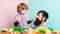 Little boy with bearded man dad playing together. happy family. leisure time. building home with colorful constructor