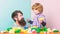 Little boy with bearded man dad playing together. happy family. leisure time. building home with colorful constructor