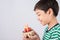 Little boy blowing candle on the cake for his birthday