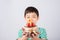Little boy blowing candle on the cake for his birthday