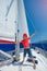 Little boy on board of sailing yacht on summer cruise. Travel adventure, yachting with child on family vacation.