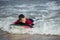 Little Boy Bodyboarding in the Sea