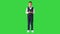 Little boy in a bow tie and waistcoat talking to the camera on a Green Screen, Chroma Key.