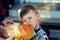 Little boy with bread on the street