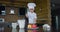 Little boy in chef's costume makes apple pie dough with whisk in the kitchen