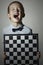 Little boy with chessboard.Children Emotion.Smile.laughter
