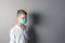 Little boy, a child in a medical mask on a bright background. The idea of an epidemic, influenza, protection from disease,