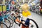 Little boy choosing bicycle in sport store