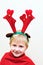 Little boy with christmas antlers