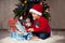 Little boy on christmas, opening presents