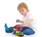 Little boy in the classroom at Montessori environment.