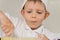 Little boy concentrating as he bakes a cake