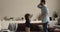 Little boy dancing with daddy at home