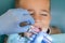 A little boy at a dentist\'s reception in a dental clinic. Children\'s dentistry, Pediatric Dentistry. A female stomatologist is