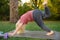 Little boy doing stretch during workout outdoors