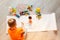 Little boy drawing a picture on the floor in his room