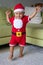 A little Boy Dressed in a Santa Outfit