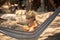 Little boy, drinking coctail, orange juice on the beack in hammock, enjoying summer