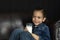 Little boy drinking milk on black background