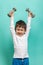 Little boy with dumbbells. Healthy lifestyle. Sports and activities for children.
