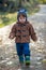 Little boy eating biscuit in park