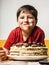 Little boy eating a cake