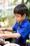 Little boy eating for food meal in the restuarant