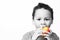 Little boy eating a red apple promoting healthy eating