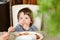 A little boy eats food and picks his nose. Little boy picking nose in breakfast