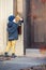 Little boy with an envelope at post office. Child sending letter. Kid throwing card into a mail box. Postal service in Europe.