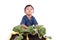 Little boy fertilizer to vegetables in pots