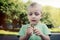 Little boy with a fidget spinner outdoors