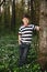 Little boy in forest on flowers field