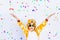 Little boy in a fun bright giraffe costume on a white isolated background with confetti, children`s birthday, place for text