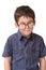 Little boy in funny round spectacles stands isolat