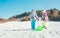 Little boy and girl carry the sled and enjoying the winter sledding time