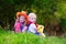 Little boy and girl dressed up as cowboy and cowgirl playing wit