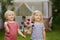 Little boy and girl having fun during walk. Happy child with pinwheel