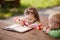 Little boy and girl learning to write