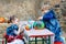 Little boy and girl painting with colors on pumpkin