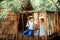 Little boy and girl playing in treehouse at forest park, Active kids on playground, Child enjoying activity in a climbing