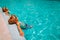 Little boy and girl relax in pool, family on beach resort