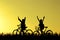 Little boy and girl riding bikes at sunset, active kids sport, Asian kid,Silhouette a kid at the sunset, Happy time.