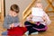 Little boy and girl sitting together reading