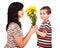 Little boy gives flowers to his mom