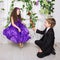 Little boy gives a rose to girl. Kids love