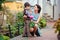 Little boy giving flower to his mom