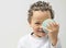 Little boy with globe in his hand with white background stock photo