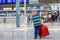 Little boy going on vacations trip with suitcase at airport