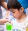 Little boy graduated at kindergarten school drinking water at school